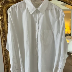 H&M - Chemise longue blanche à poche