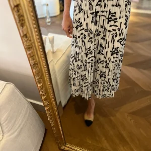 Jupe Maje plissée blanche et noire